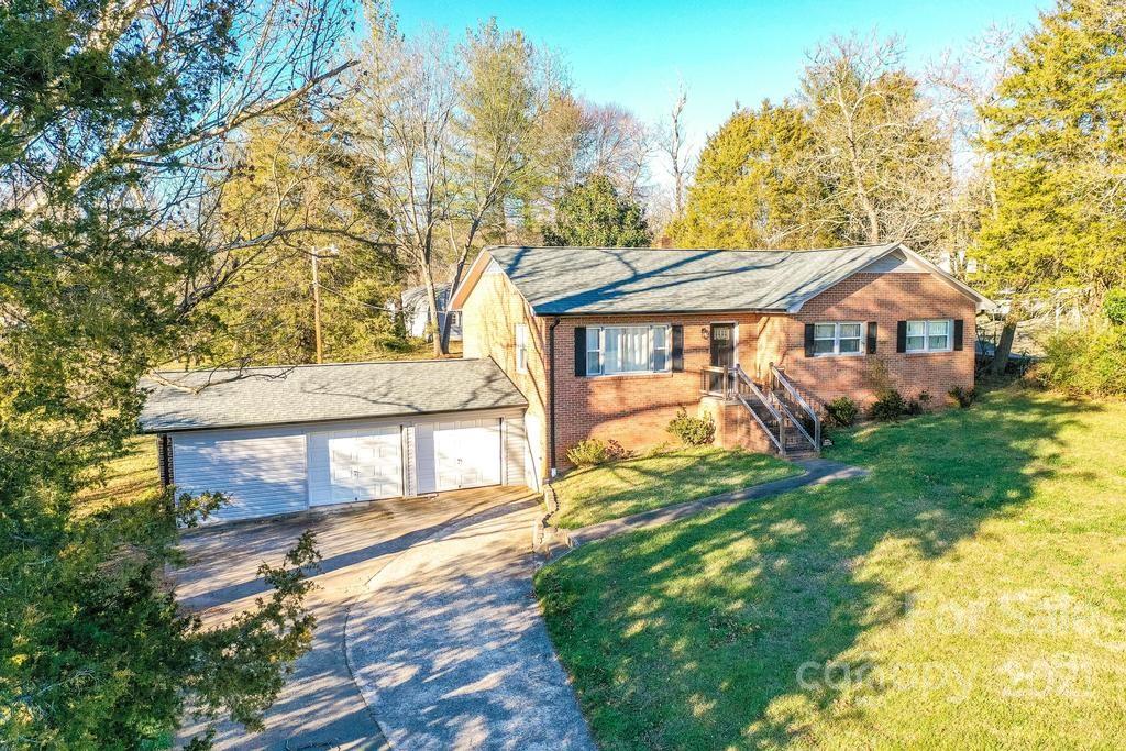 5196 Jenkins Road Morganton, NC 28655 - Photo 41 of 46 a front view of a house with a yard and large trees