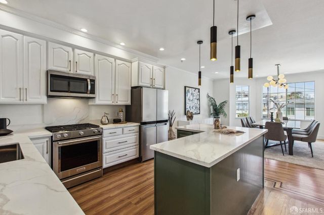 a view of entryway with wooden floor and stairs
