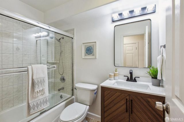 a view of a chairs and table on the balcony