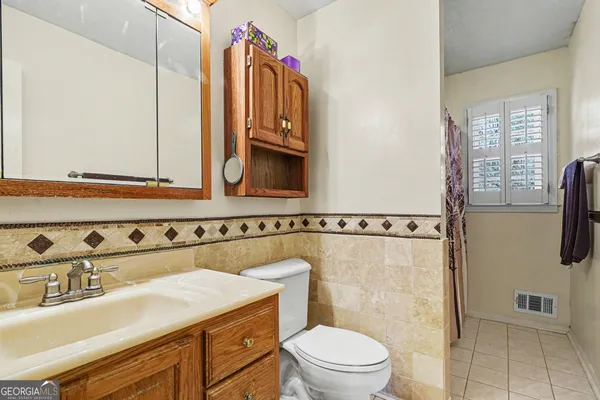 a room with gym equipment and windows