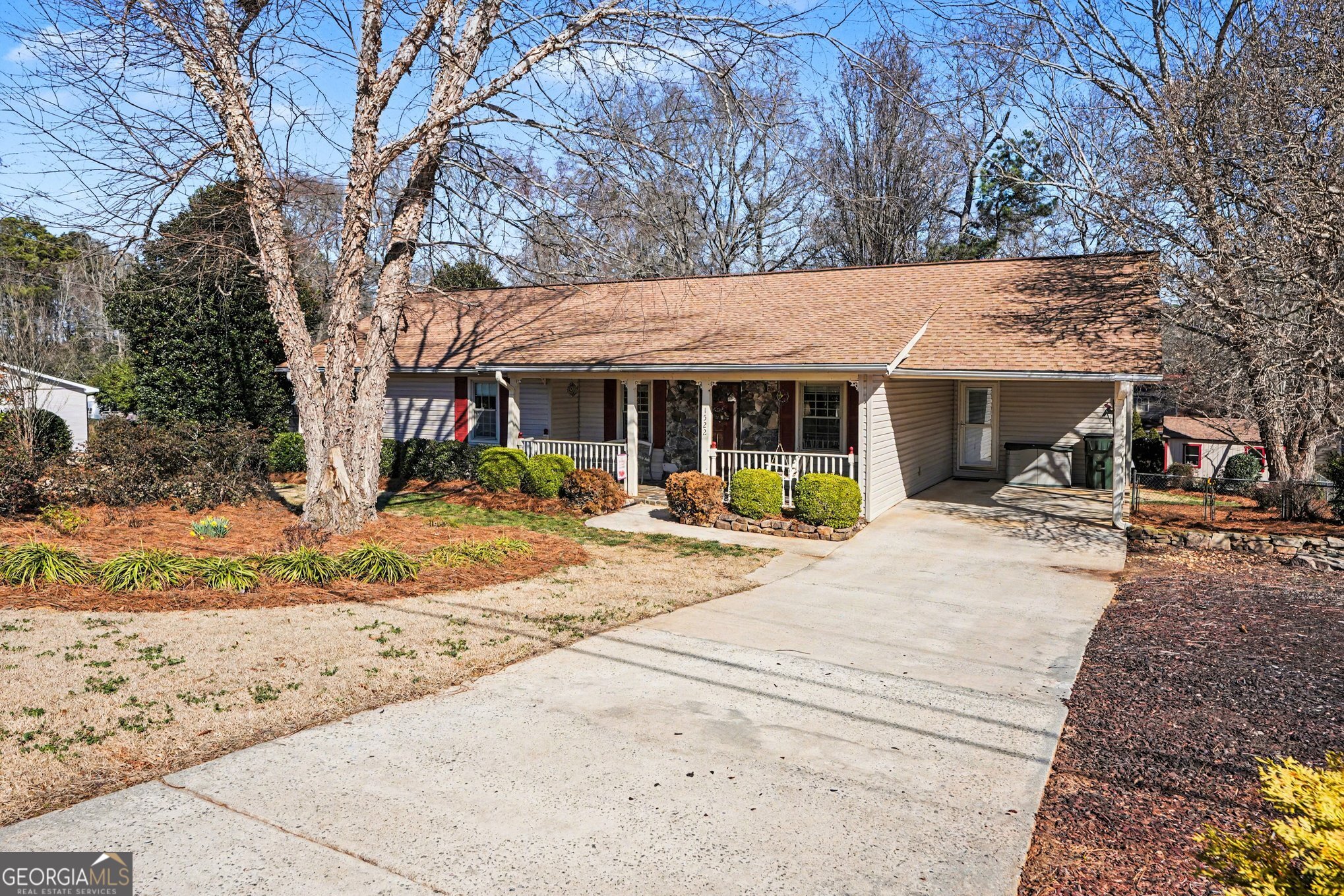 1522 Zebulon Road Griffin, GA 30224 - Photo 4 of 28 a view of a white house with a large tree