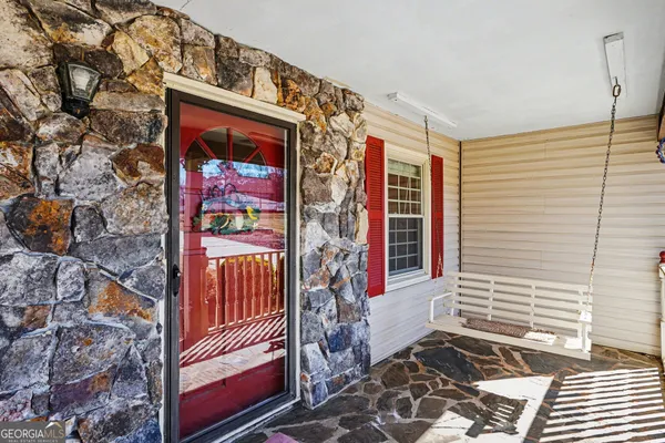 a living room with furniture fireplace and flat screen tv