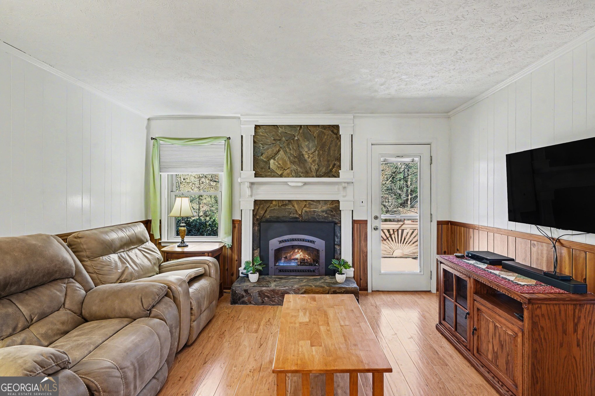 1522 Zebulon Road Griffin, GA 30224 - Photo 7 of 28 a living room with furniture and a fireplace