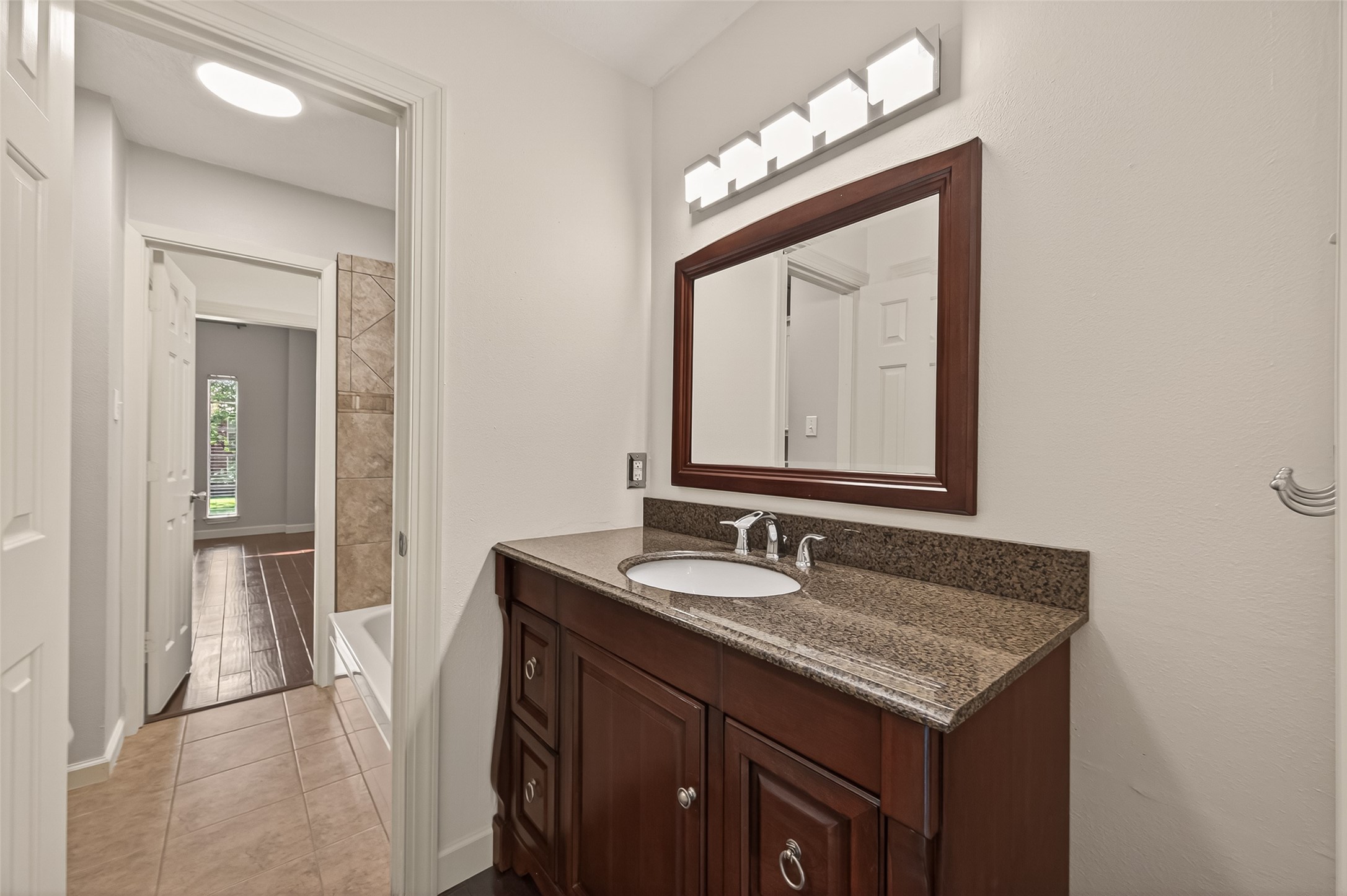 6131 Hampton Way Court Spring, TX 77389 - Photo 28 of 50 a bathroom with a sink vanity and a mirror