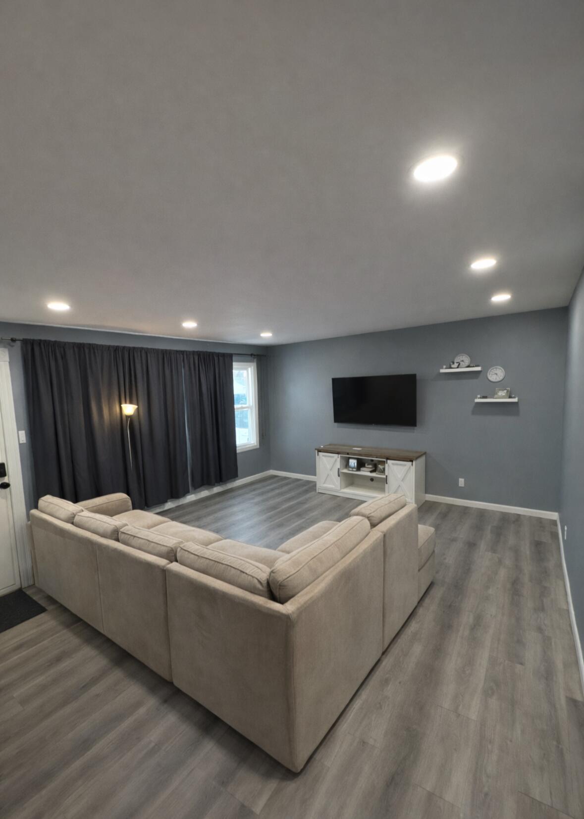 726-1 Imperial Road Valparaiso, IN 46385 - Photo 2 of 8 a living room with stainless steel appliances kitchen island furniture and wooden floor