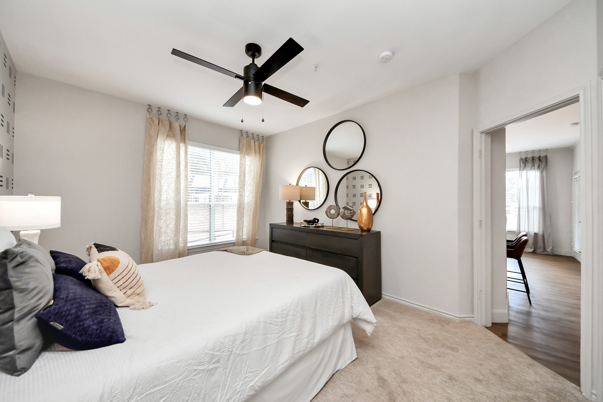 3003 Memorial Court, Unit 2434 Houston, TX 77007 - Photo 30 of 34 a bedroom with a bed and a chandelier