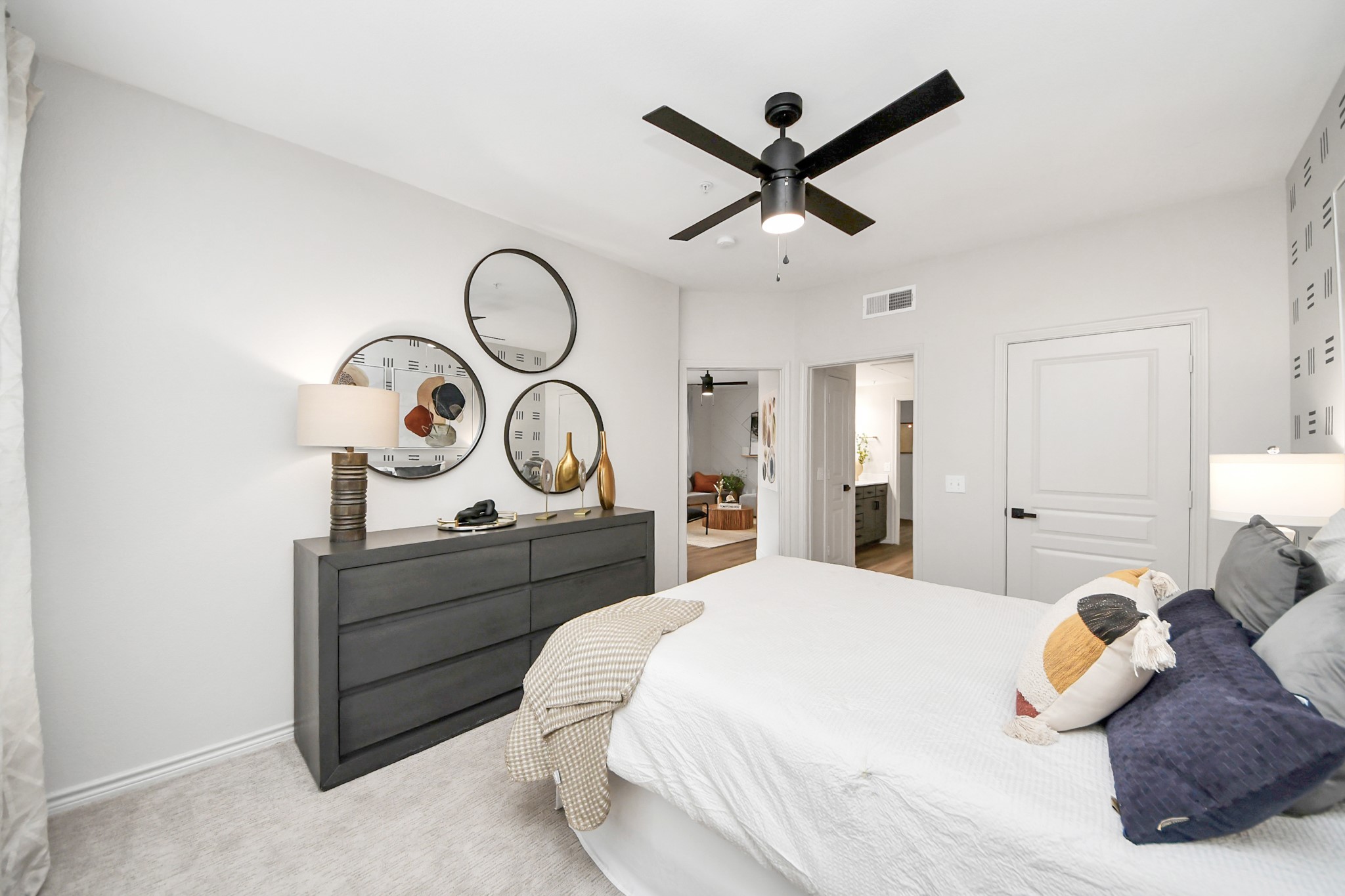 3003 Memorial Court, Unit 2434 Houston, TX 77007 - Photo 32 of 34 a bed room with a bed and a chandelier