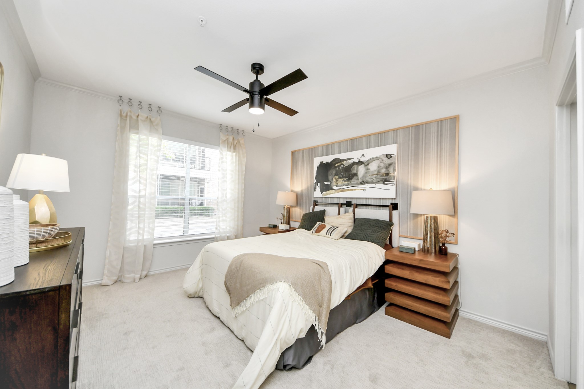 3003 Memorial Court, Unit 2434 Houston, TX 77007 - Photo 14 of 34 a bedroom with a large bed and a chandelier