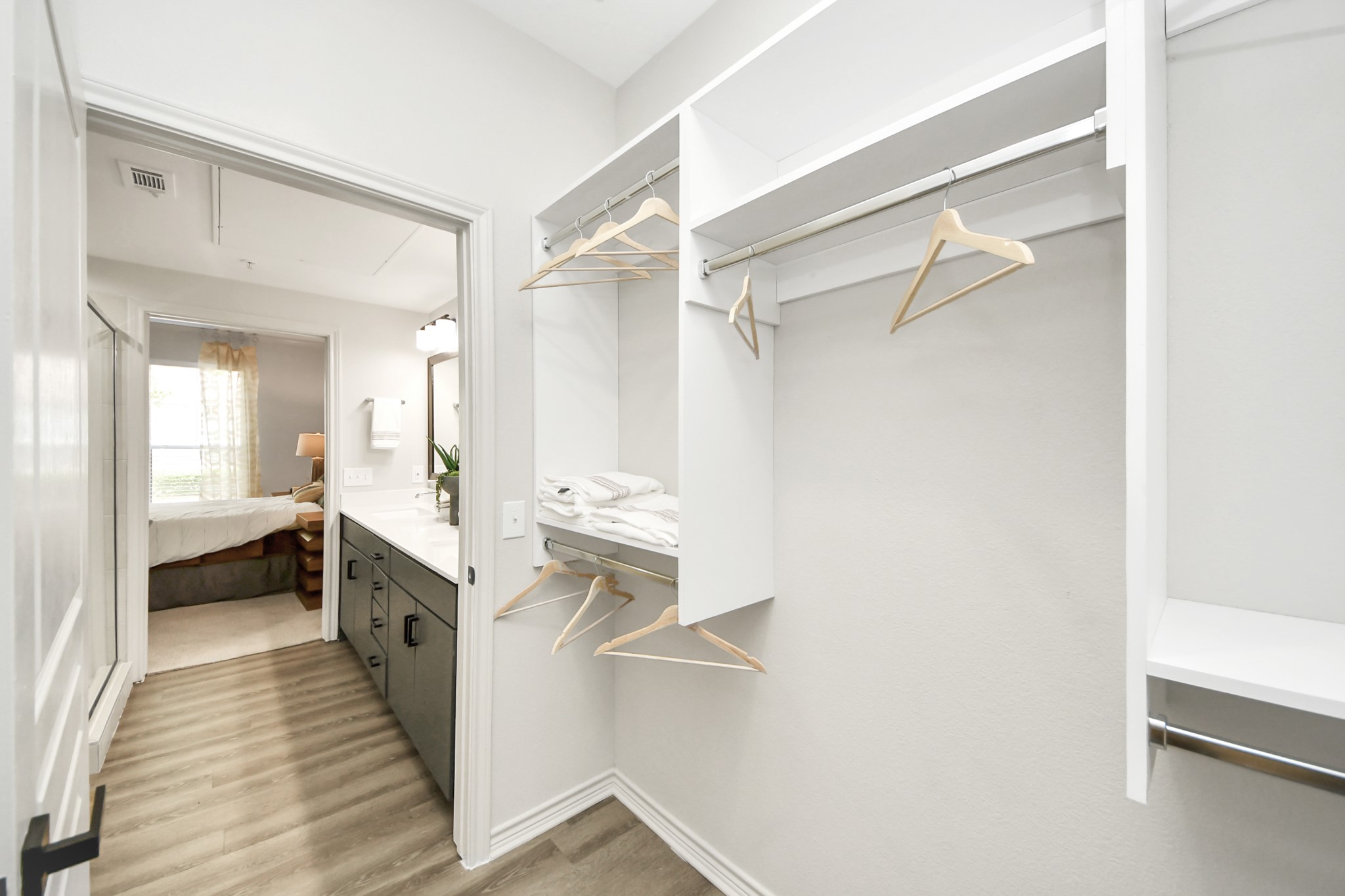 3003 Memorial Court, Unit 2434 Houston, TX 77007 - Photo 18 of 34 a bathroom with a sink a mirror and a shower