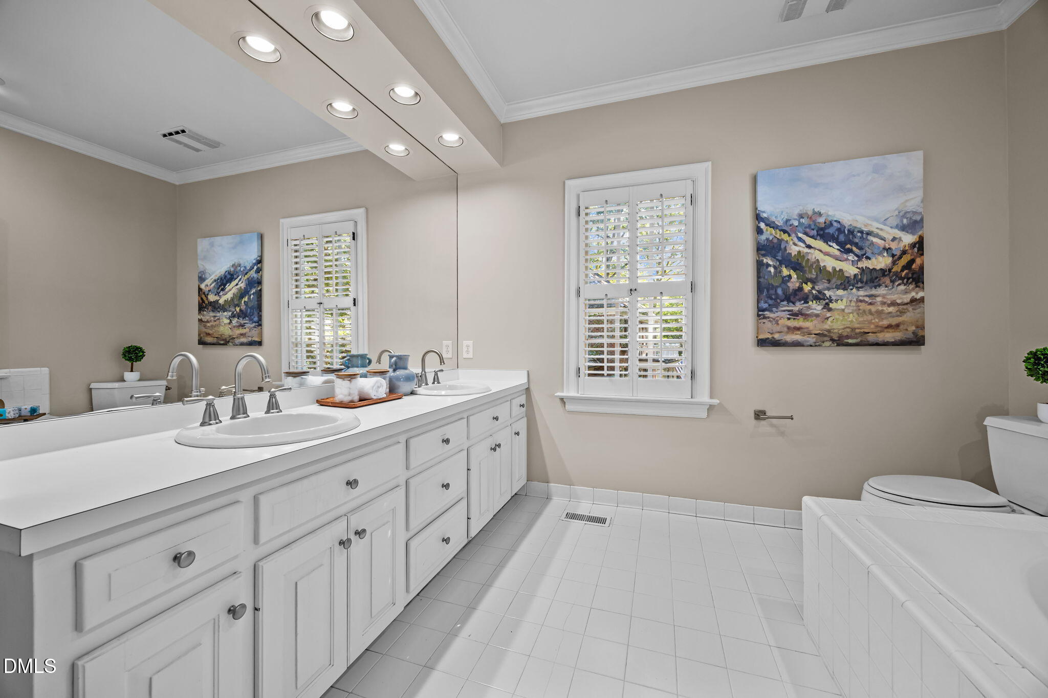 1535 Crenshaw Point Wake Forest, NC 27587 - Photo 15 of 27 a spacious bathroom with double vanity a mirror a bathtub and a window