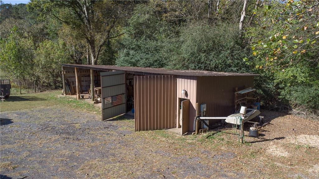 4920 McCoy Circle Cumming, GA 30040 - Photo 21 of 31 a view of a house with a backyard and wooden fence