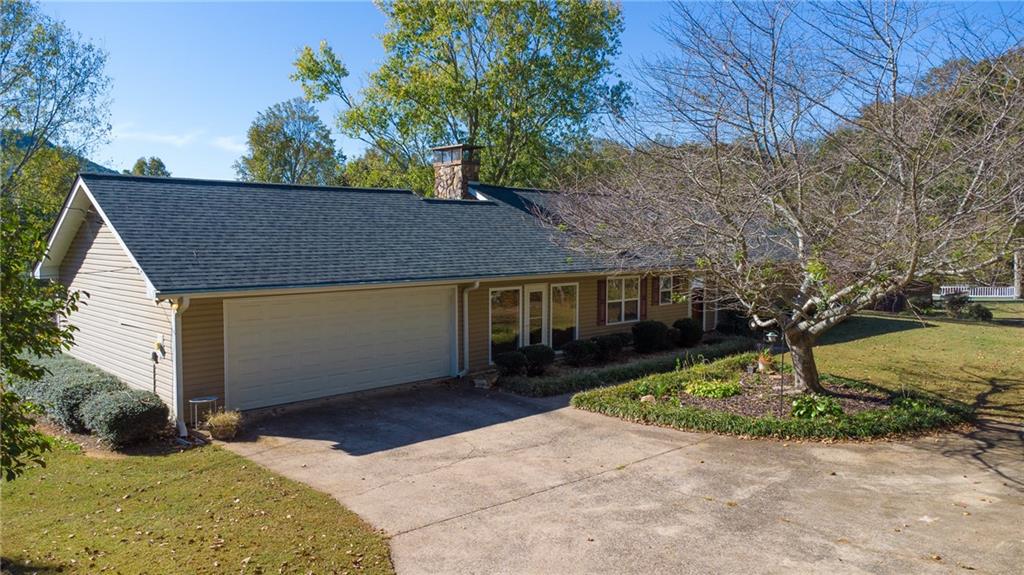 4920 McCoy Circle Cumming, GA 30040 - Photo 24 of 31 a front view of a house with a yard