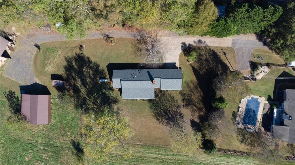 4920 McCoy Circle Cumming, GA 30040 - Photo 29 of 31 an aerial view of a house with a yard