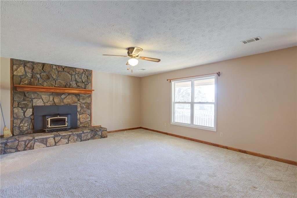 4920 McCoy Circle Cumming, GA 30040 - Photo 7 of 31 a view of a livingroom with a fireplace