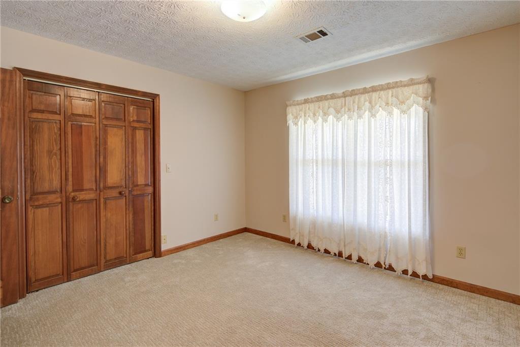 4920 McCoy Circle Cumming, GA 30040 - Photo 10 of 31 an empty room with windows