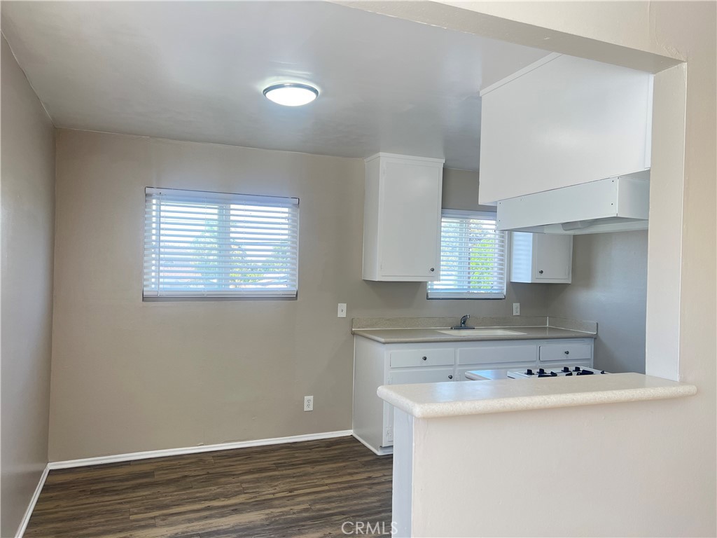 4920 Maine Avenue, Unit M Baldwin Park, CA 91706 - Photo 7 of 17 a kitchen with a cabinets and wooden floor