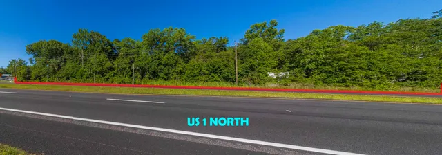 a view of a yard with a street