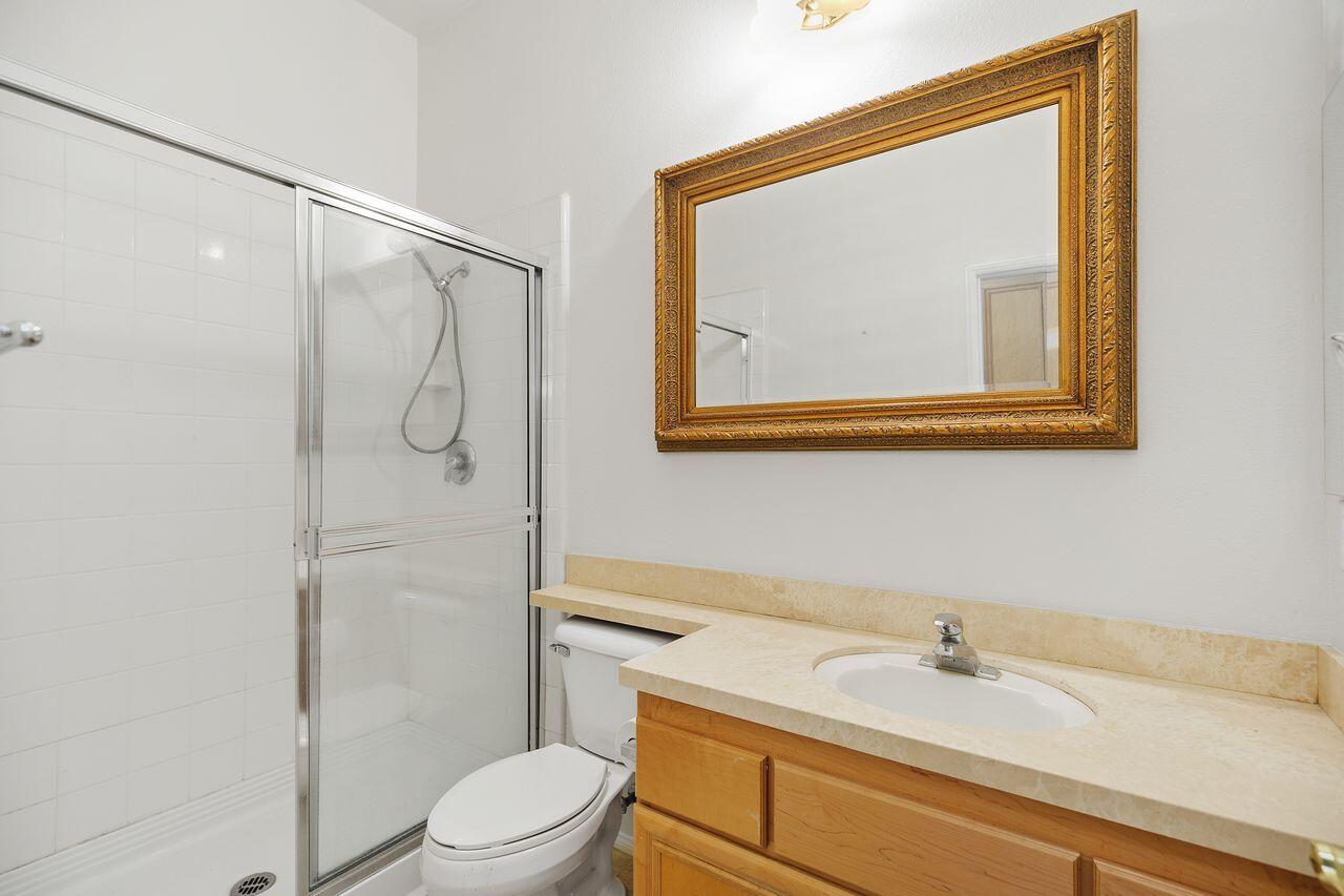 75715 Heritage West Palm Desert, CA 92211 - Photo 26 of 51 a bathroom with a sink vanity mirror and toilet