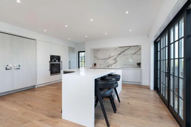 a view of kitchen with furniture and wooden floor