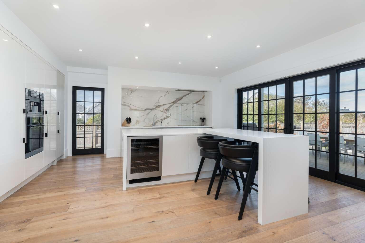 11 A Meadow Lane Nantucket, MA 02554 - Photo 12 of 20 a view of a big room with furniture and windows