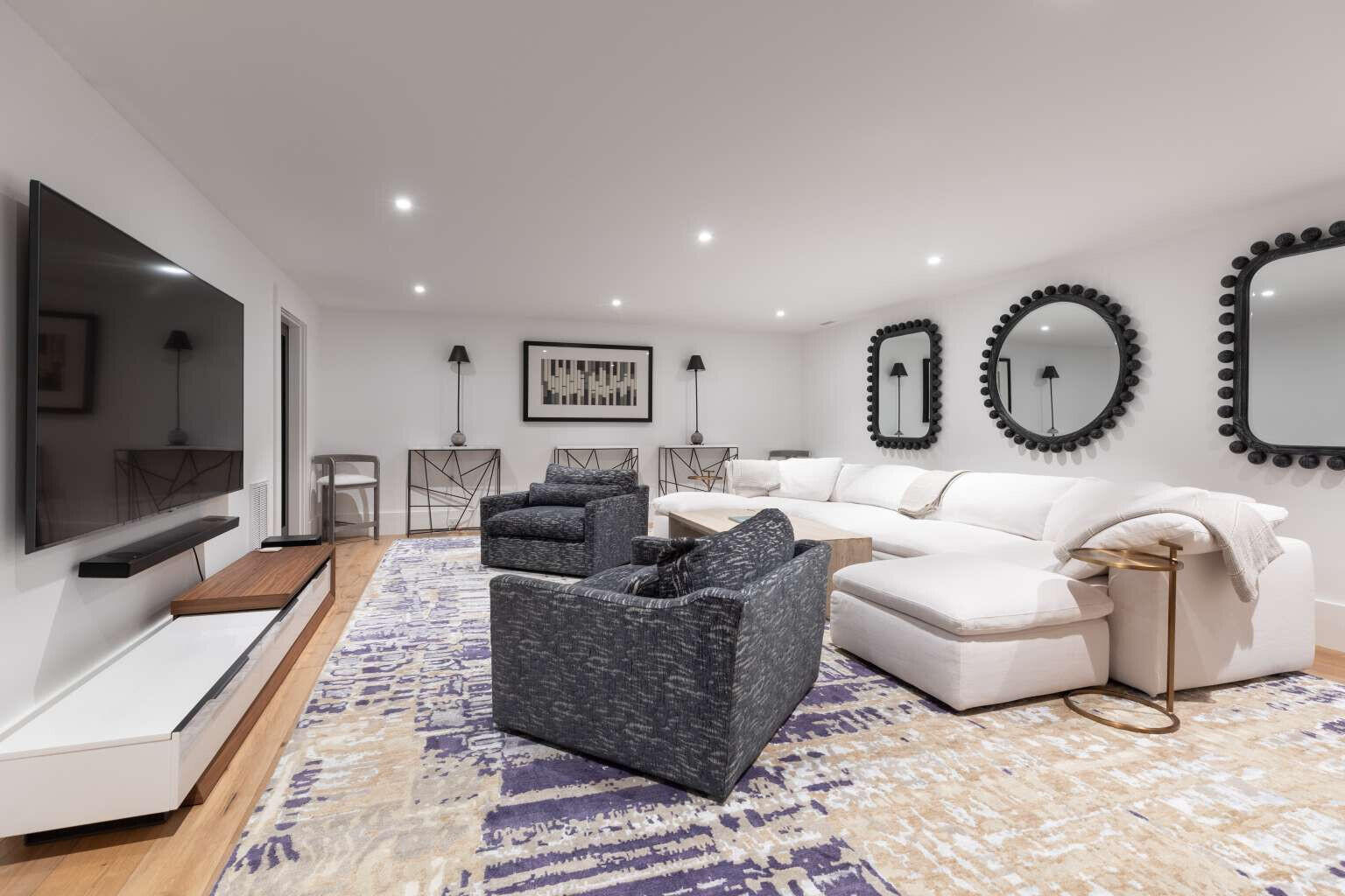 11 A Meadow Lane Nantucket, MA 02554 - Photo 18 of 20 a living room with furniture a flat screen tv and a large window