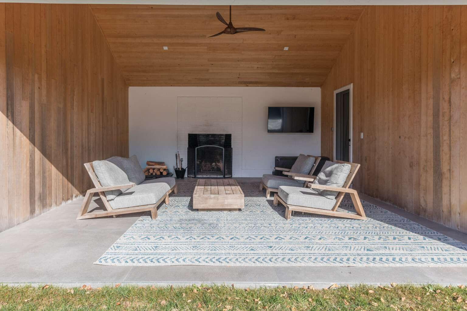 11 A Meadow Lane Nantucket, MA 02554 - Photo 20 of 20 a living room with furniture and a fireplace