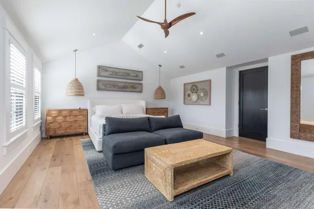 a living room with furniture and a rug