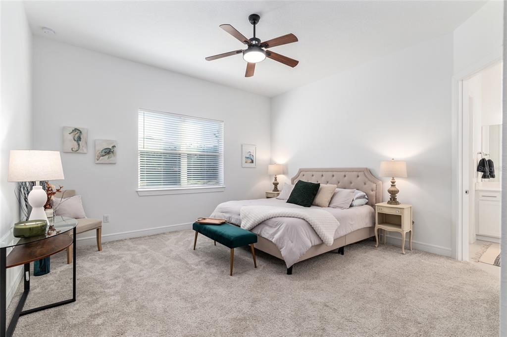 8809 Southwest 61st Loop Ocala, FL 34481 - Photo 13 of 41 a bedroom with a bed and a window