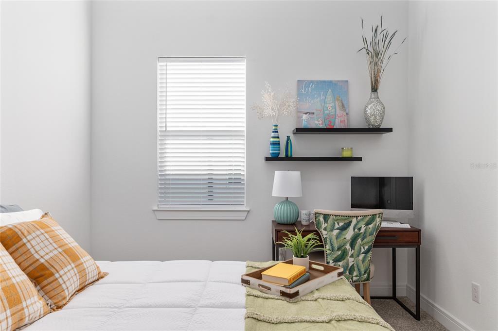 8809 Southwest 61st Loop Ocala, FL 34481 - Photo 17 of 41 a living room with furniture and a window