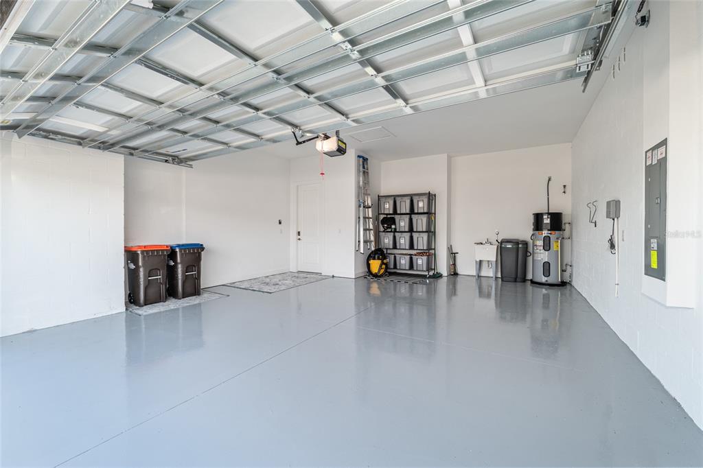 8809 Southwest 61st Loop Ocala, FL 34481 - Photo 23 of 41 a view of a livingroom with wooden floor and a ceiling fan