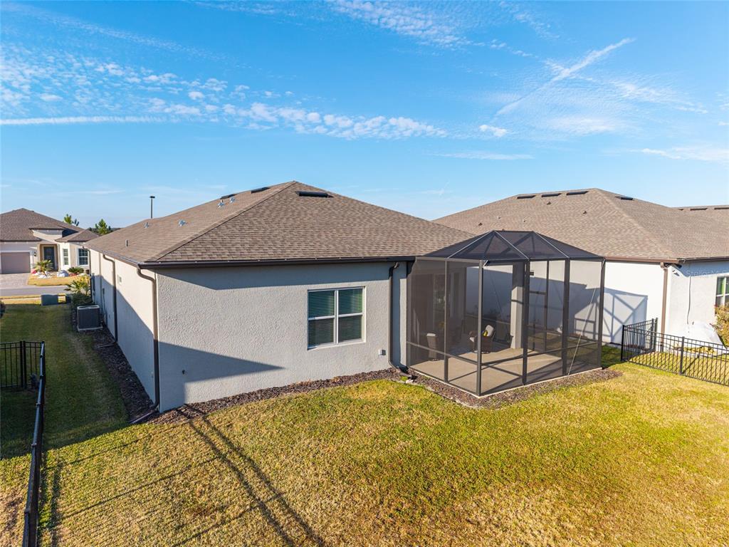 8809 Southwest 61st Loop Ocala, FL 34481 - Photo 26 of 41 a view of a house with backyard and porch
