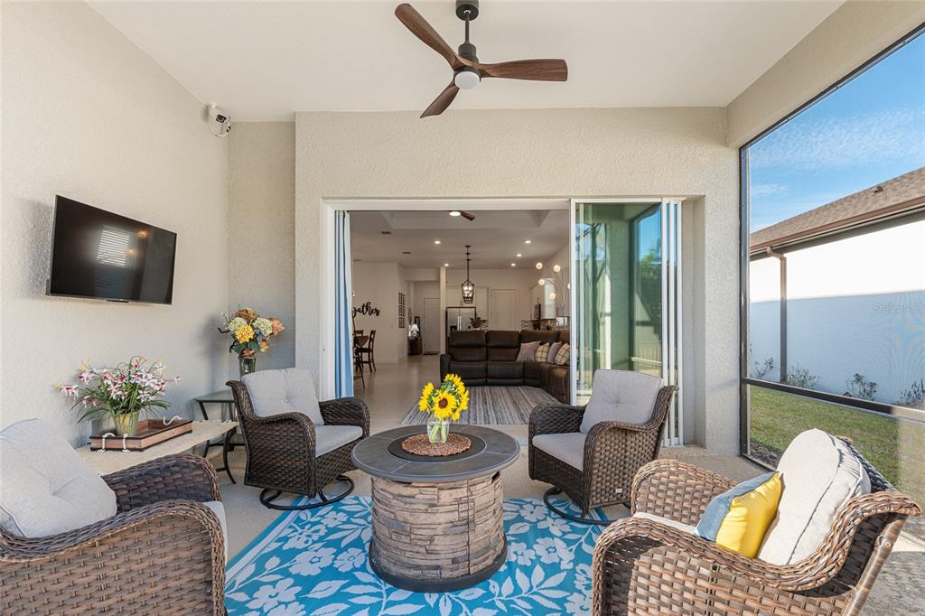 8809 Southwest 61st Loop Ocala, FL 34481 - Photo 29 of 41 a living room with furniture and a flat screen tv
