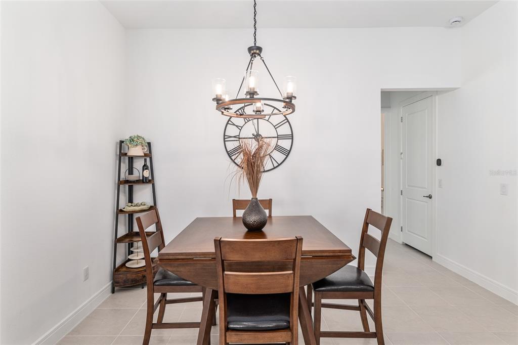 8809 Southwest 61st Loop Ocala, FL 34481 - Photo 10 of 41 a view of a room with a table and chairs