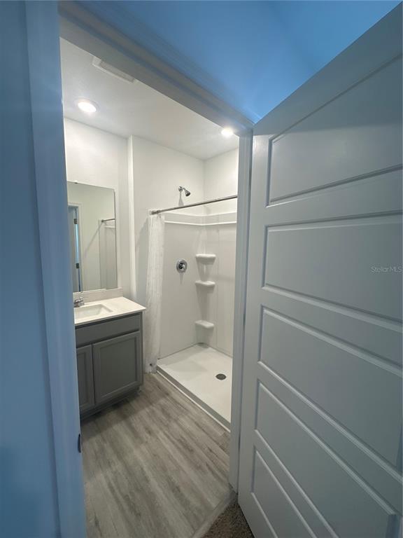 4667 Ostero Street Winter Haven, FL 33880 - Photo 12 of 24 a bathroom with a sink a toilet and shower