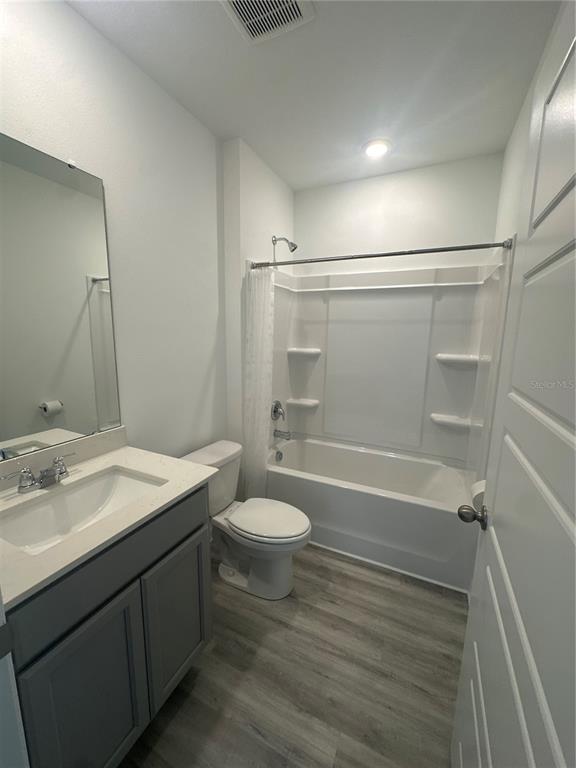 4667 Ostero Street Winter Haven, FL 33880 - Photo 16 of 24 a bathroom with a sink a toilet and shower