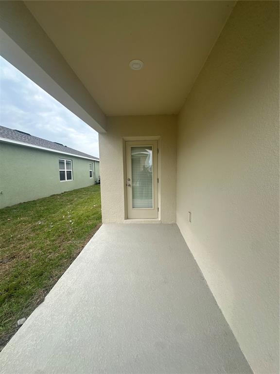 4667 Ostero Street Winter Haven, FL 33880 - Photo 20 of 24 a view of an empty room with window