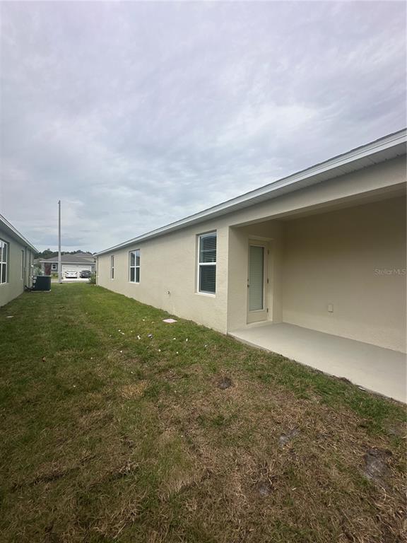 4667 Ostero Street Winter Haven, FL 33880 - Photo 21 of 24 a view of a backyard