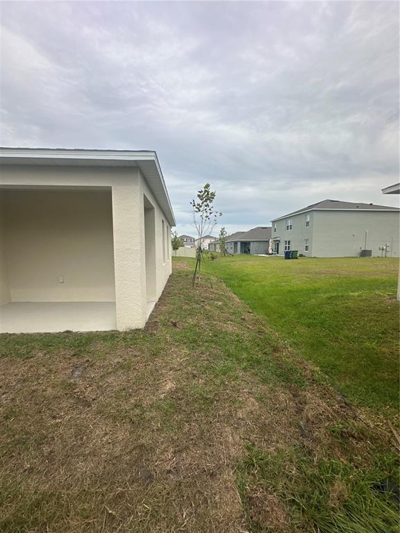 4667 Ostero Street Winter Haven, FL 33880 - Photo 22 of 24 a view of a big room with an empty space