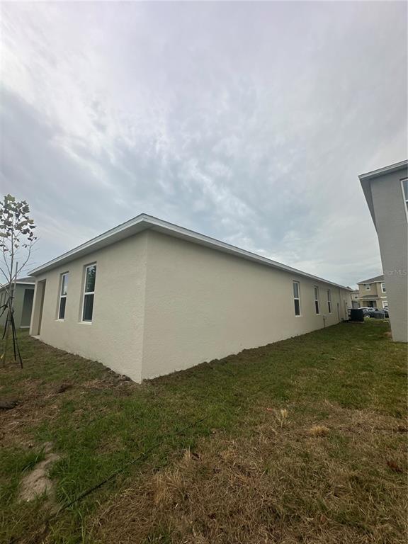 4667 Ostero Street Winter Haven, FL 33880 - Photo 23 of 24 a backyard of a house