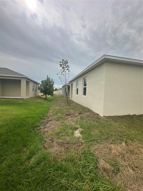 4667 Ostero Street Winter Haven, FL 33880 - Photo 24 of 24 a house view with a outdoor space