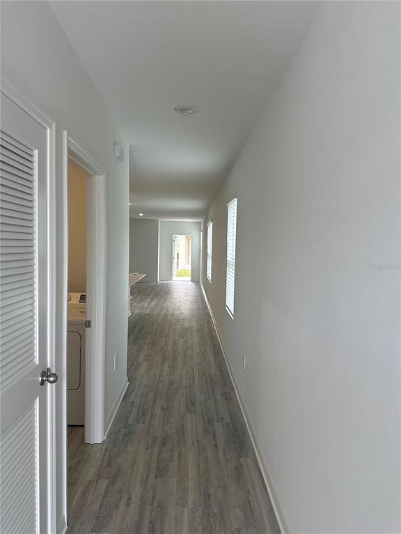 4667 Ostero Street Winter Haven, FL 33880 - Photo 4 of 24 a view of hallway with wooden floor