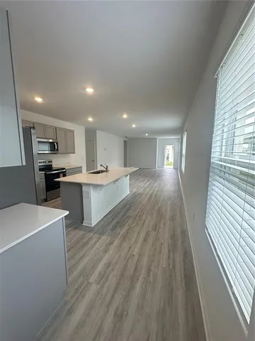a view of kitchen with wooden floor