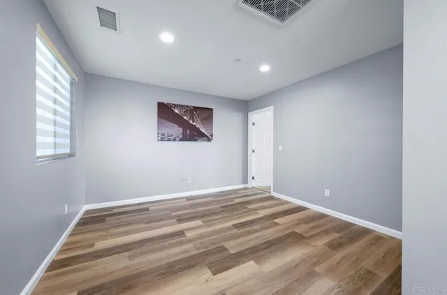 a view of room with window and ceiling fan