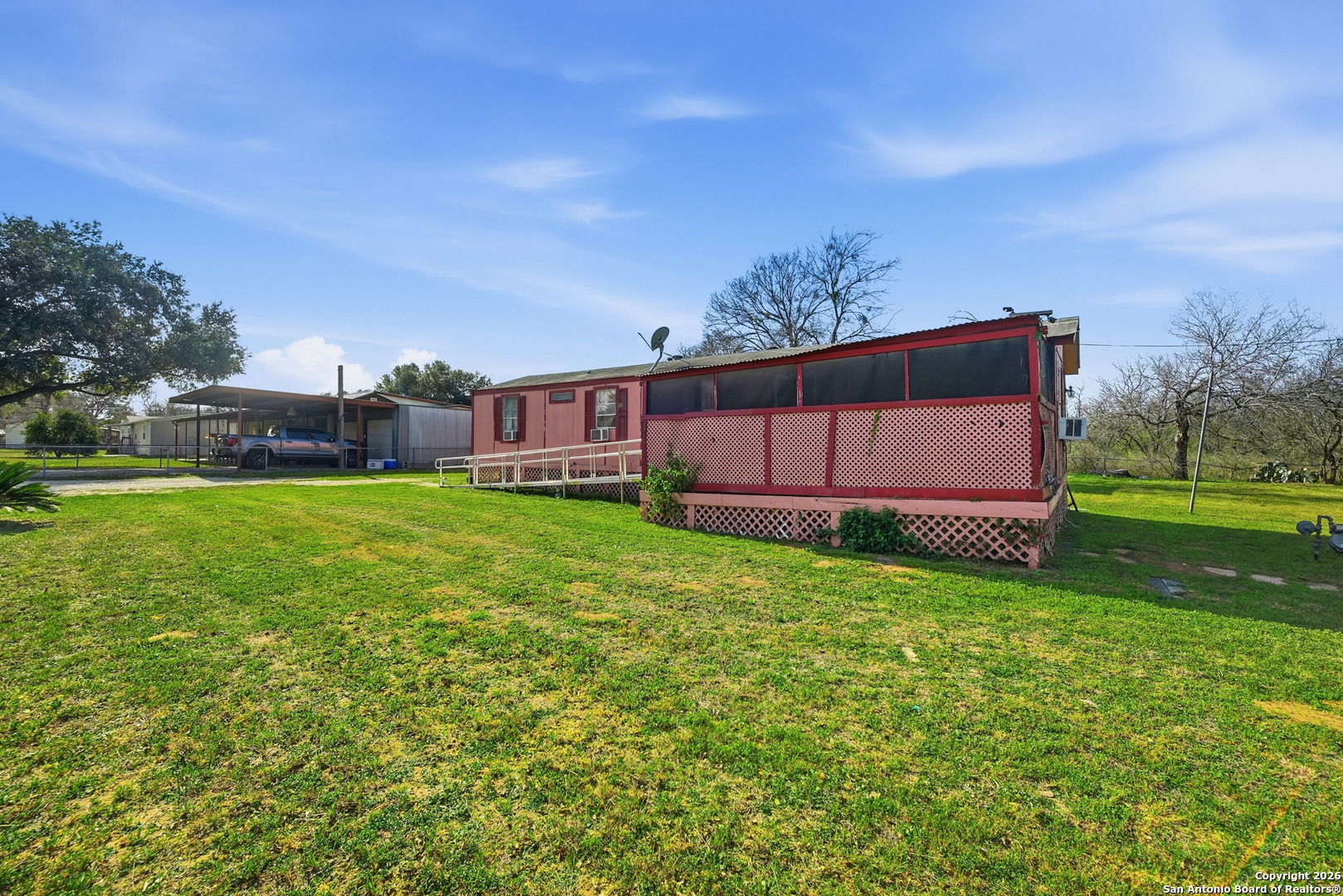 a view of a house with a big yard