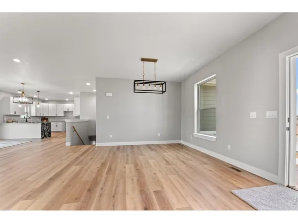 a view of a kitchen with furniture and a window
