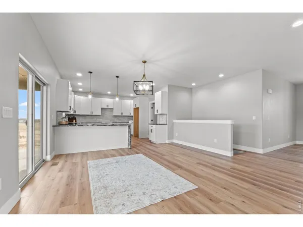 a view of kitchen with wooden floor