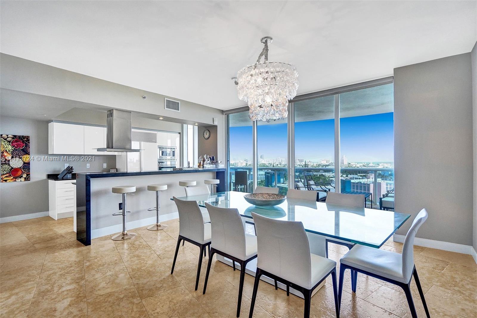 400 Alton Road, Unit 1011 Miami Beach, FL 33139 - Photo 2 of 27 a view of a dining room with furniture window and outside view