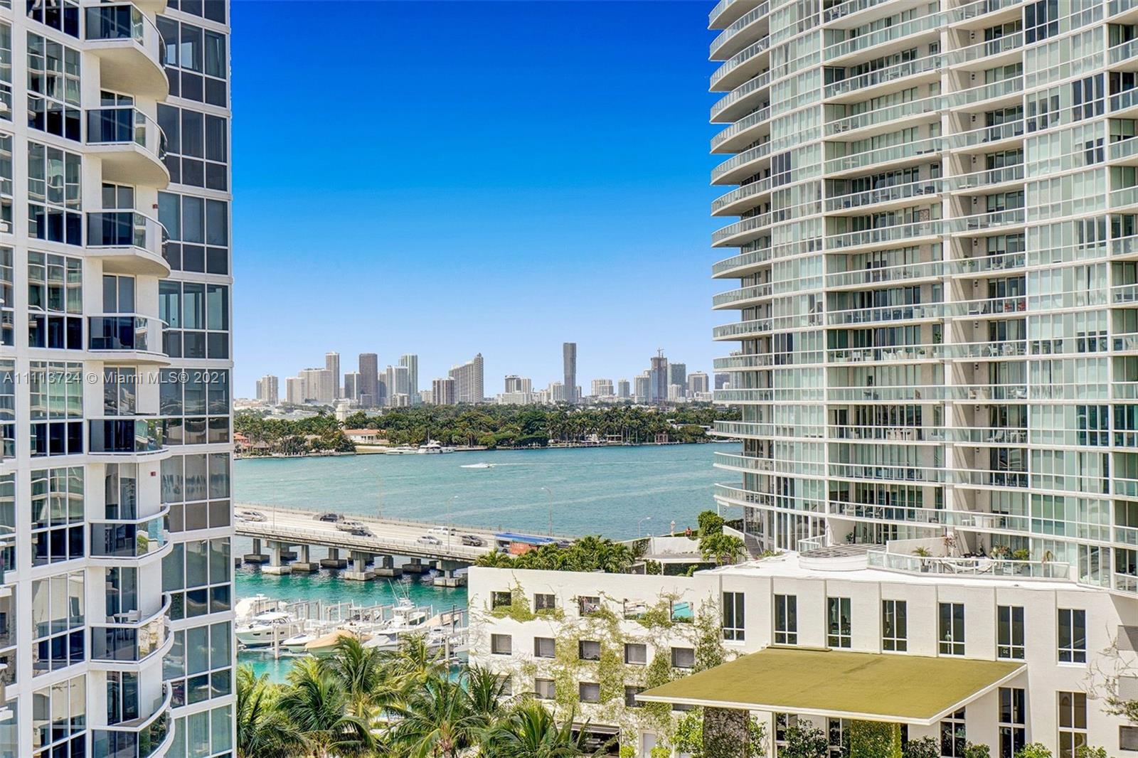 400 Alton Road, Unit 1011 Miami Beach, FL 33139 - Photo 11 of 27 a view of a building with lake view and tall buildings