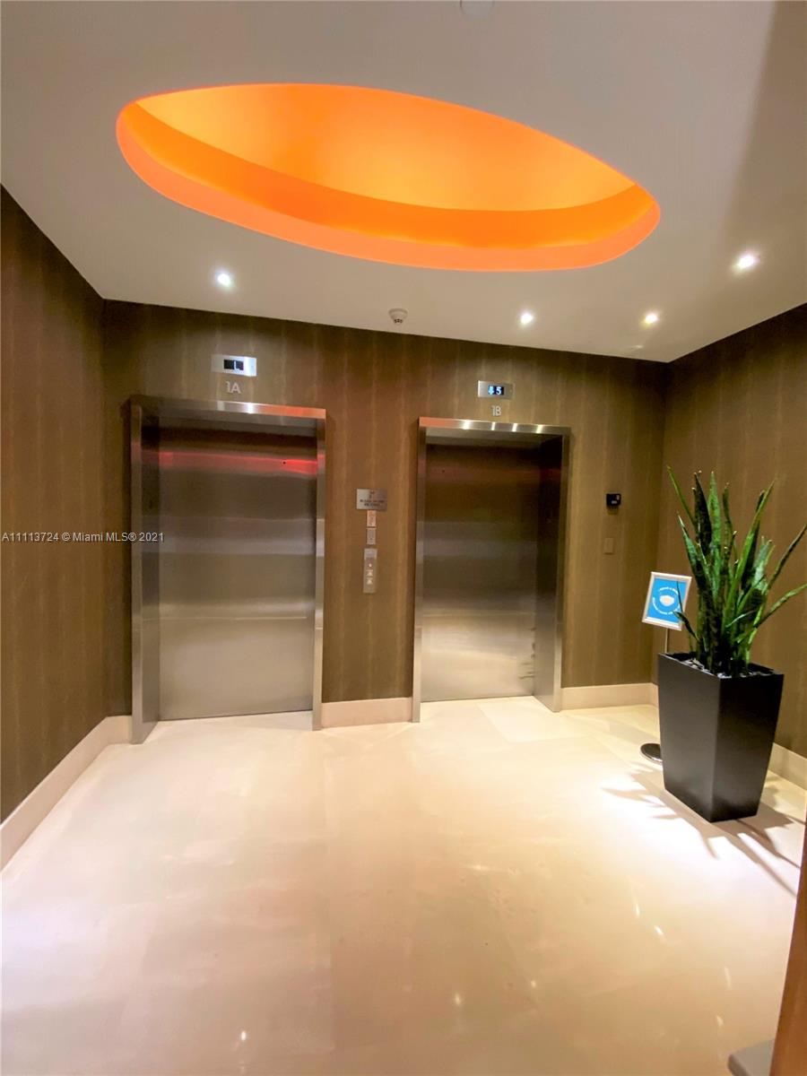 400 Alton Road, Unit 1011 Miami Beach, FL 33139 - Photo 20 of 27 a view of a livingroom with a staircase