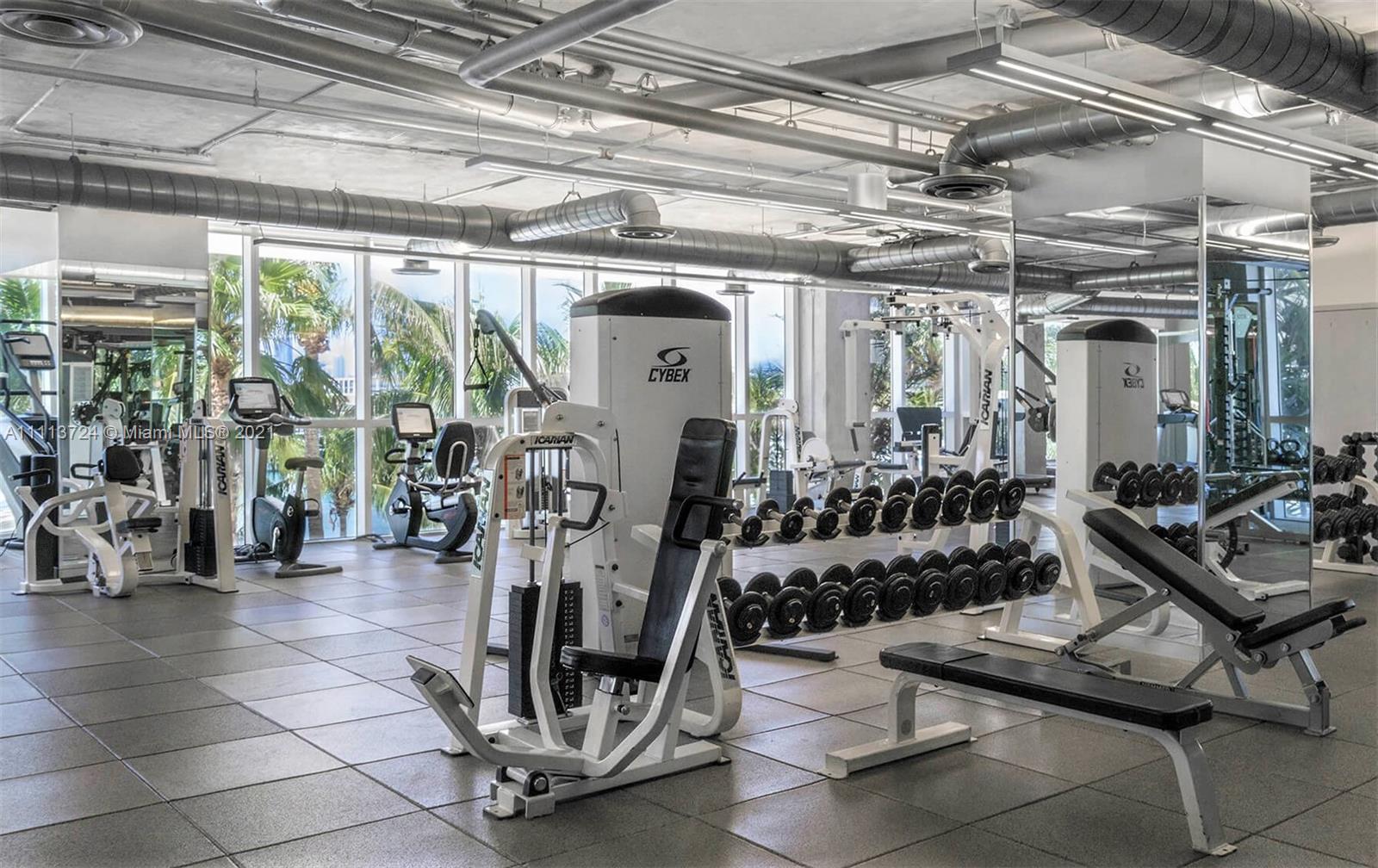 400 Alton Road, Unit 1011 Miami Beach, FL 33139 - Photo 24 of 27 a view of a room with gym equipment